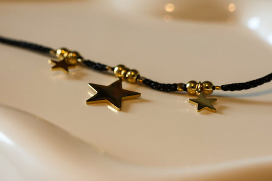 Wickel-Choker schwarz mit Sternen im Gold-Look
